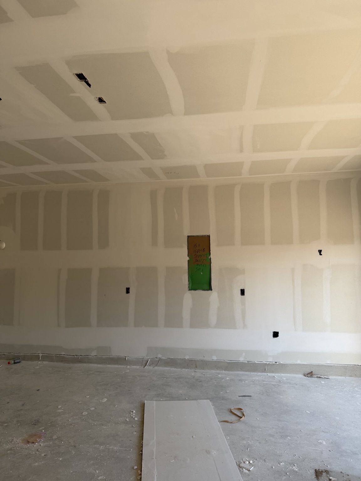 Wide room with drywall joints taped and bedded